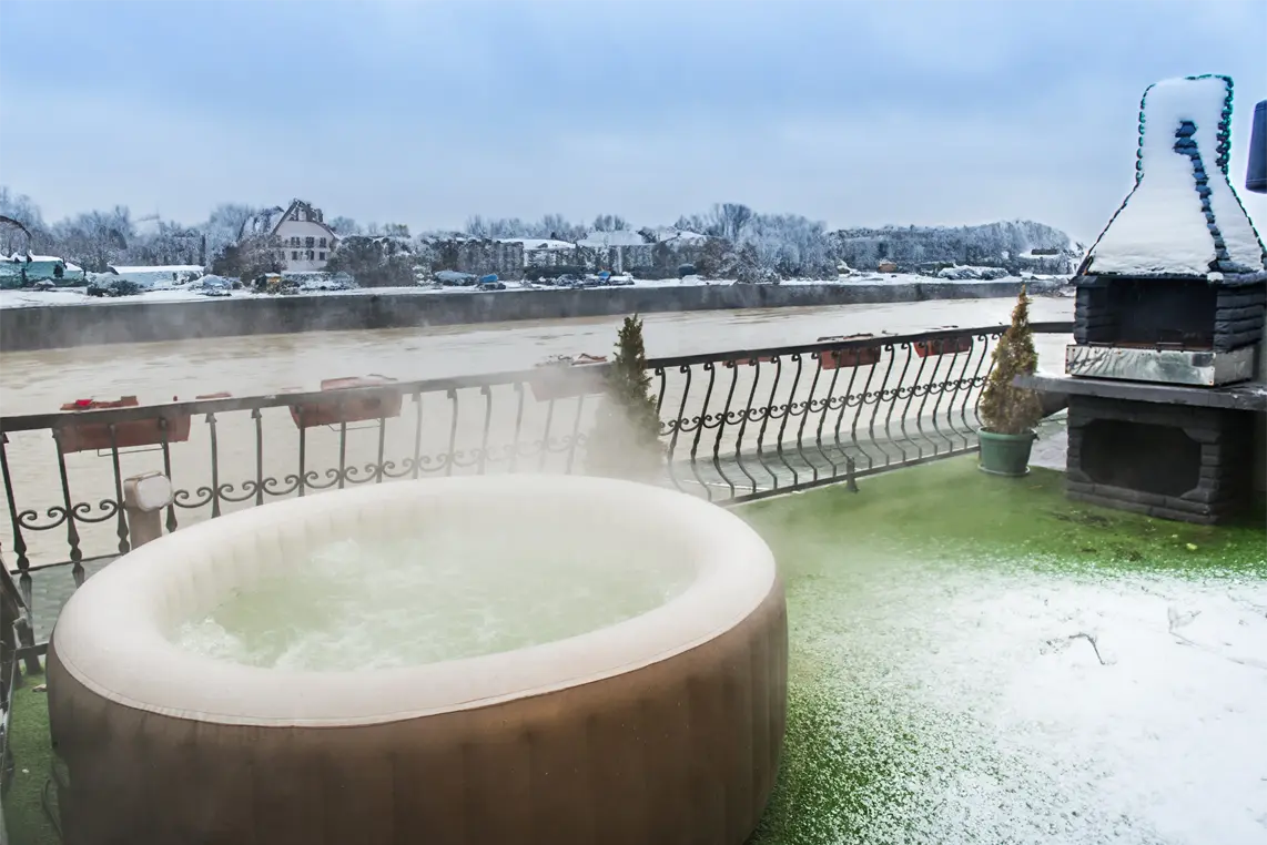 Image of an outdoor Intex Inflatable Hot Tub with a great view during winter